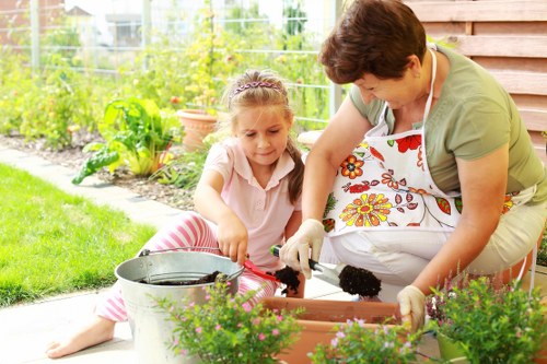 Gardener wearing safety gloves preparing tools in a residential garden