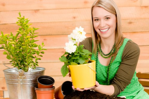 Image of a gardener working on raised beds to improve physical accessibility