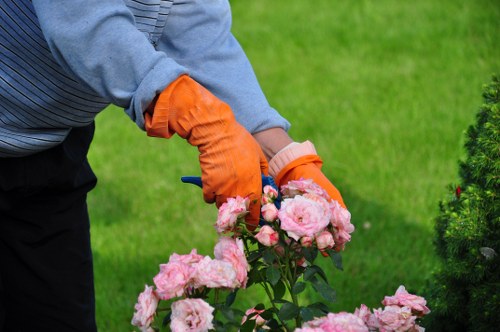 First aid kit and safety signage at a garden worksite