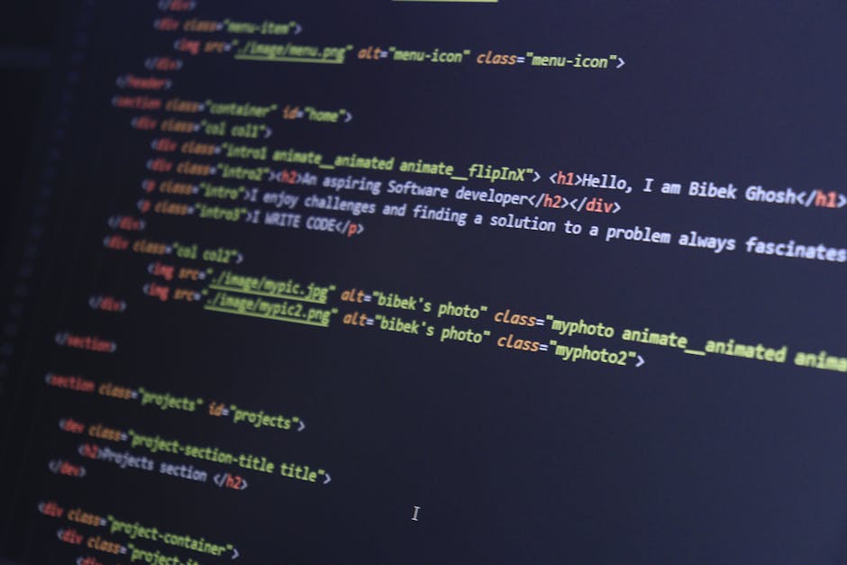 A close-up view of a computer screen displaying HTML code with colorful syntax highlighting, including tags and attributes related to web development. The code features elements such as <h1> headers,